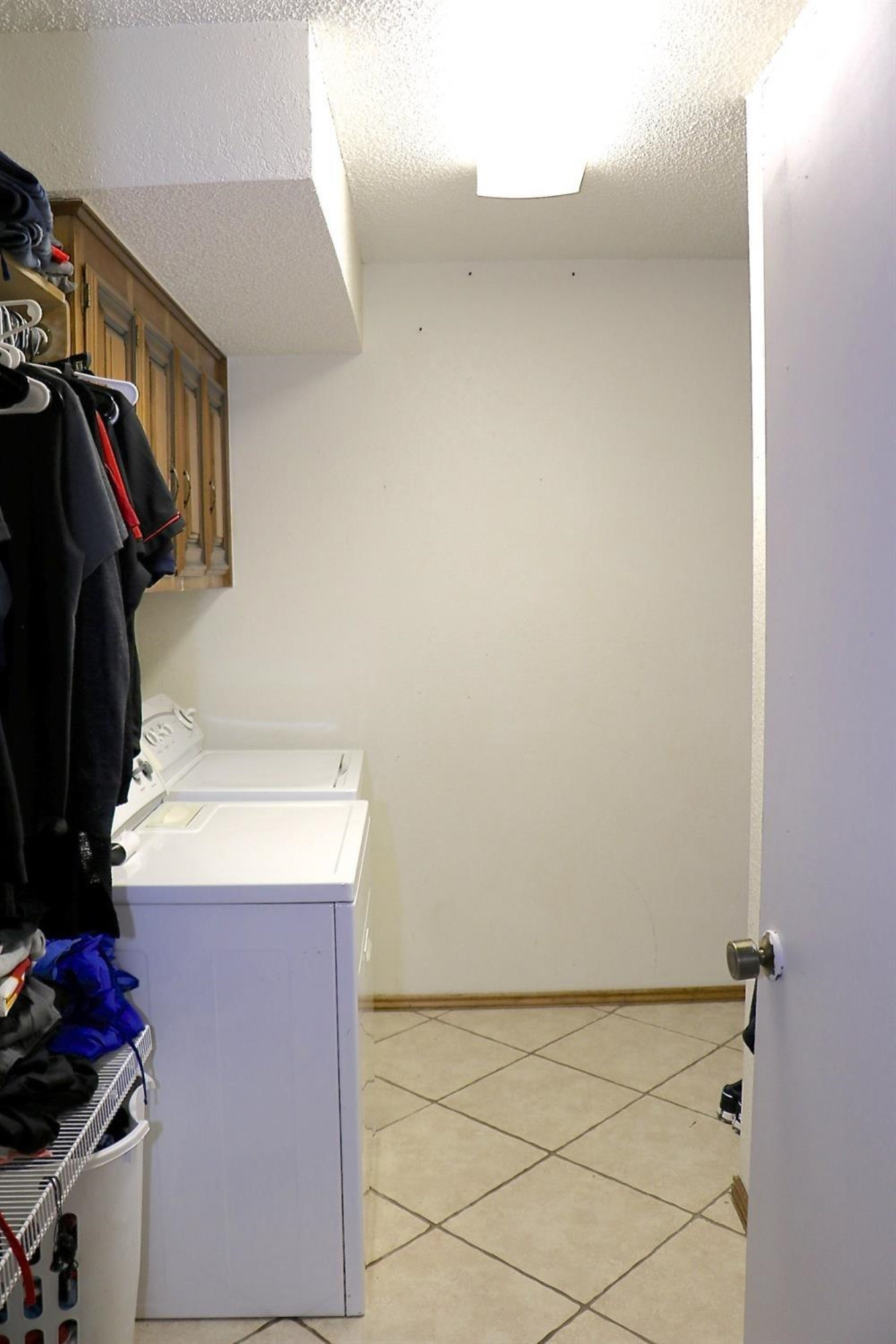 7004 Elkhart Avenue Lubbock, TX 79424 - Photo 13 of 16 a utility room with dryer and washer