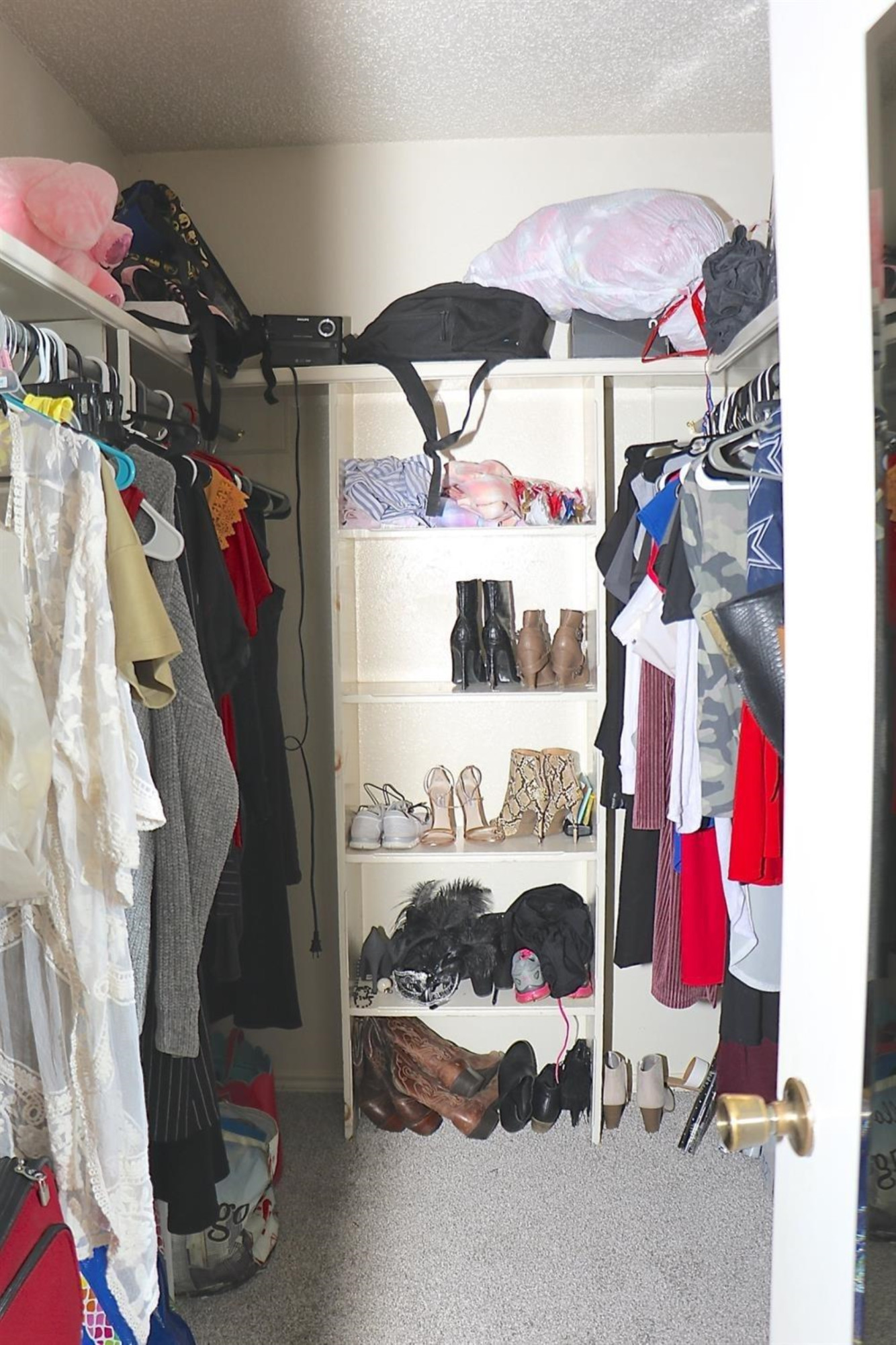 7004 Elkhart Avenue Lubbock, TX 79424 - Photo 8 of 16 a view of walk in closet with clothes and shoes
