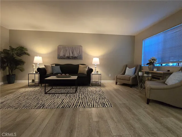 a living room with furniture and a rug