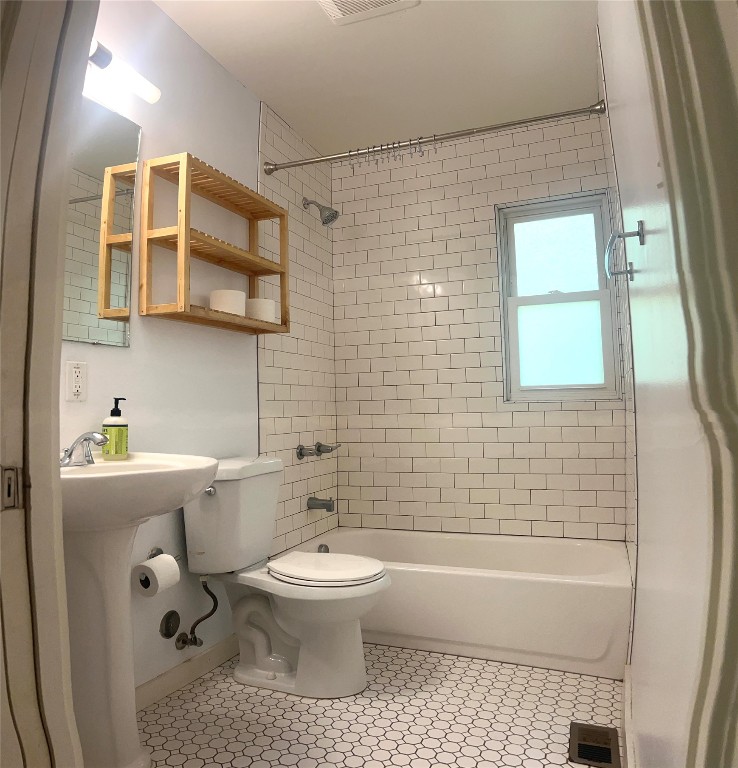 1322 Morgan Lane, Unit B Austin, TX 78704 - Photo 4 of 6 Bathroom featuring bathing tub / shower combination and light tile patterned flooring
