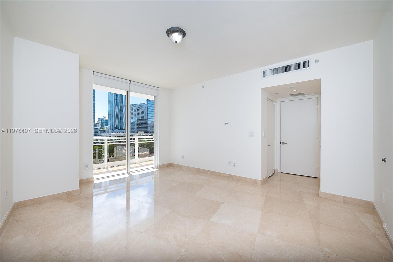901 Brickell Key Boulevard, Unit 901 Miami, FL 33131 - Photo 13 of 35 a view of an empty room