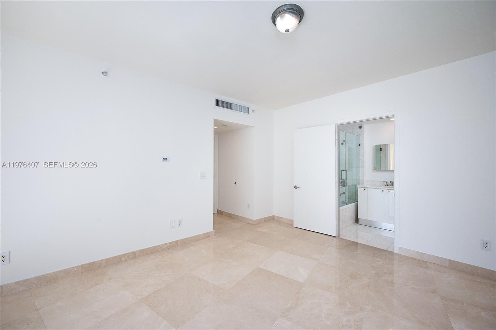 901 Brickell Key Boulevard, Unit 901 Miami, FL 33131 - Photo 14 of 35 a view of an empty room
