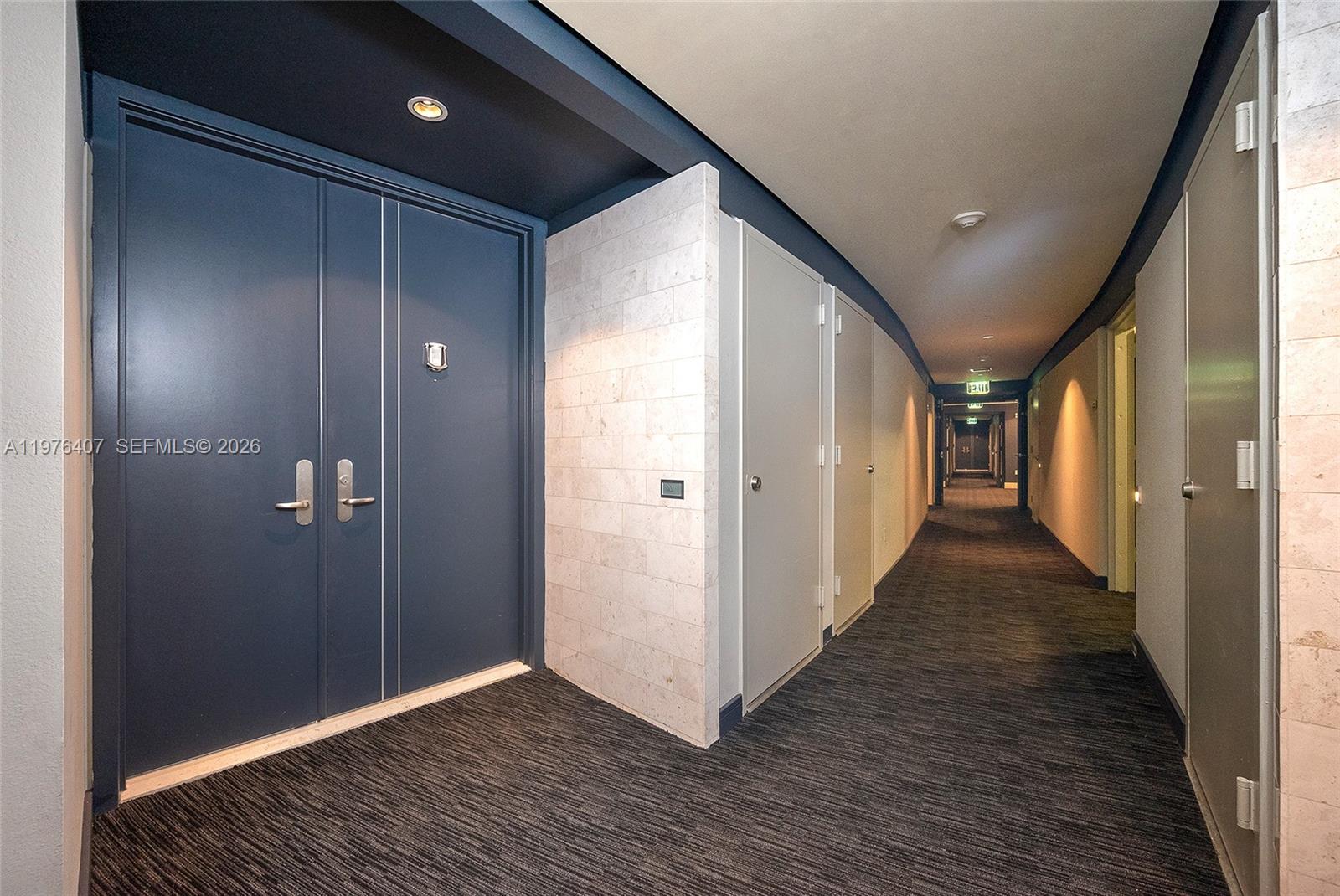 901 Brickell Key Boulevard, Unit 901 Miami, FL 33131 - Photo 22 of 35 a view of hallway with wooden floor