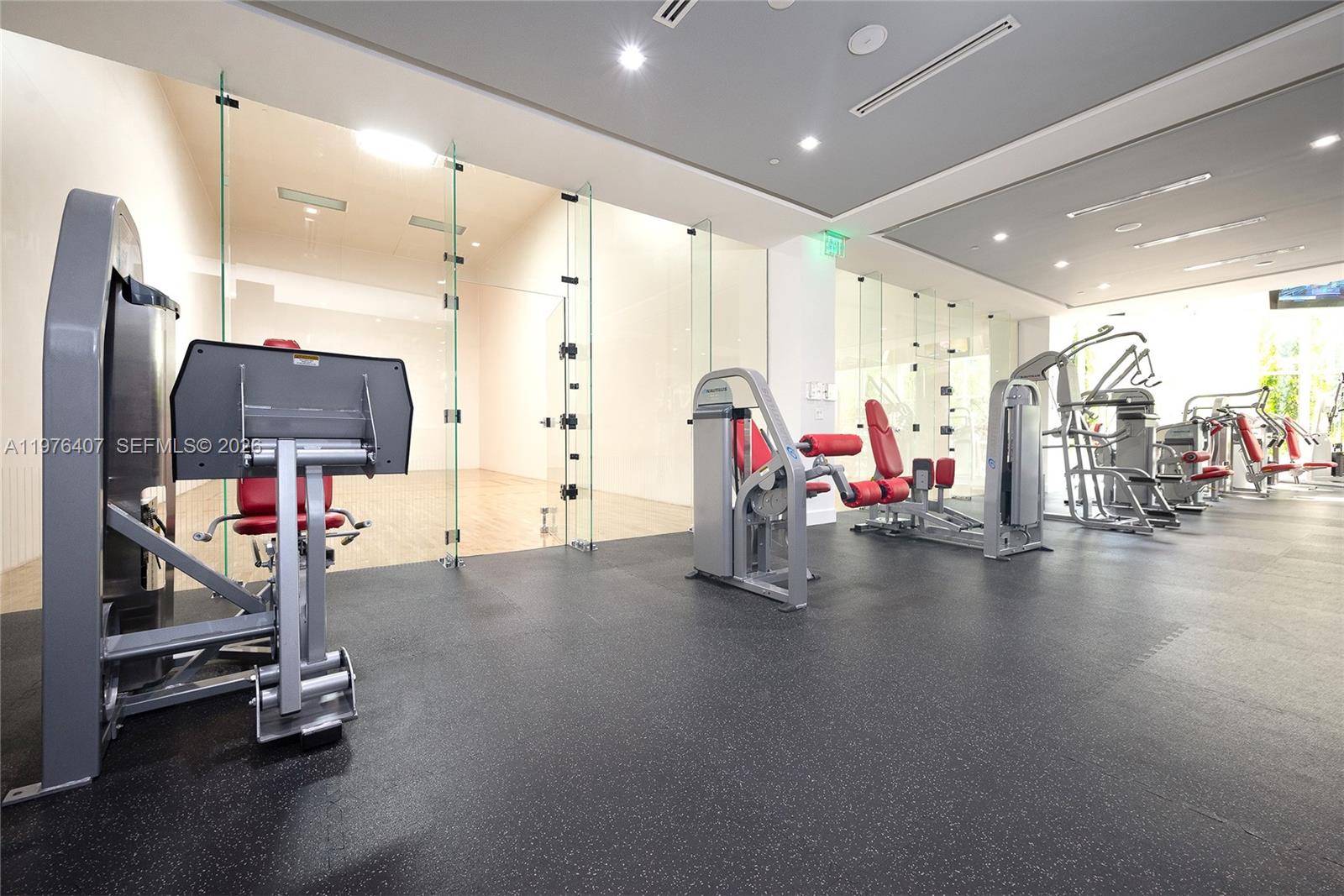 901 Brickell Key Boulevard, Unit 901 Miami, FL 33131 - Photo 24 of 35 a view of a room with gym equipment