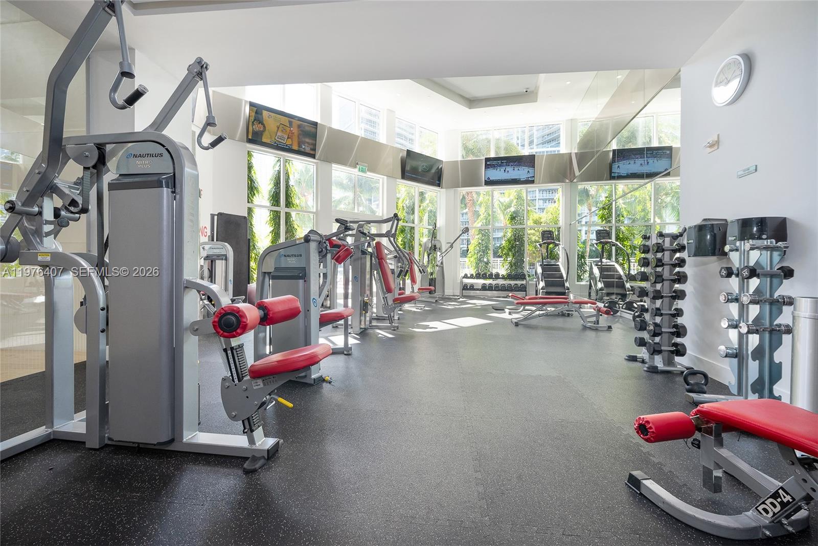901 Brickell Key Boulevard, Unit 901 Miami, FL 33131 - Photo 25 of 35 a view of a room with gym equipment
