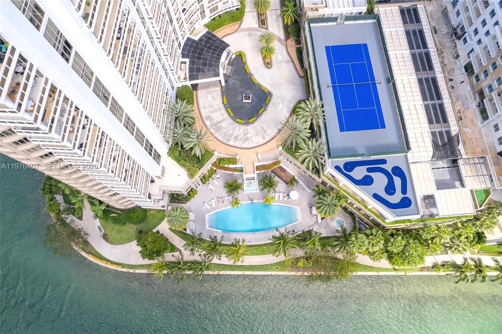901 Brickell Key Boulevard, Unit 901 Miami, FL 33131 - Photo 32 of 35 a bathroom with a sink and a mirror