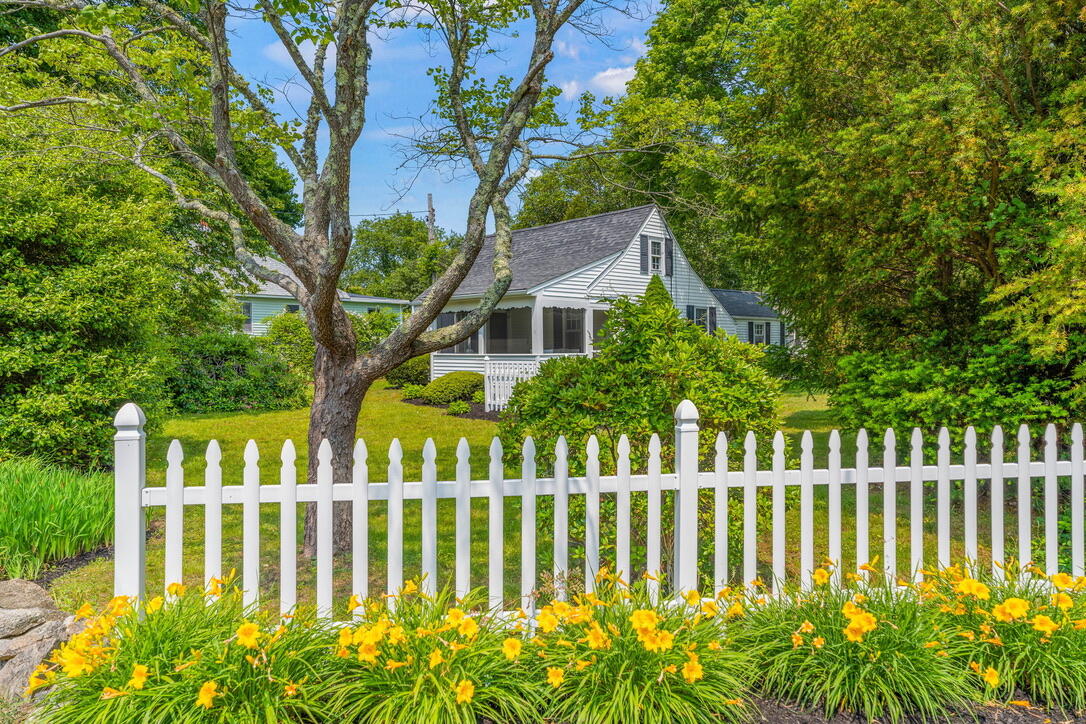 4 Dunaskin Road Centerville, MA 02632 - Photo 2 of 27 a front view of a house with a garden