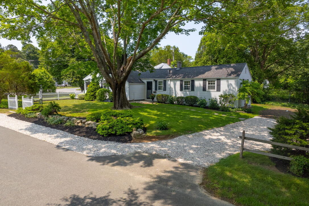 4 Dunaskin Road Centerville, MA 02632 - Photo 3 of 27 a front view of a house with a garden