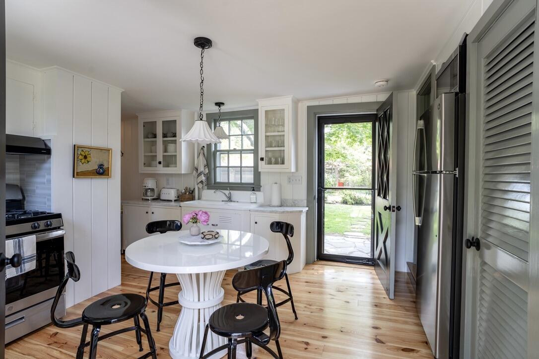 4 Dunaskin Road Centerville, MA 02632 - Photo 7 of 27 a view of a dining room with furniture window and wooden floor