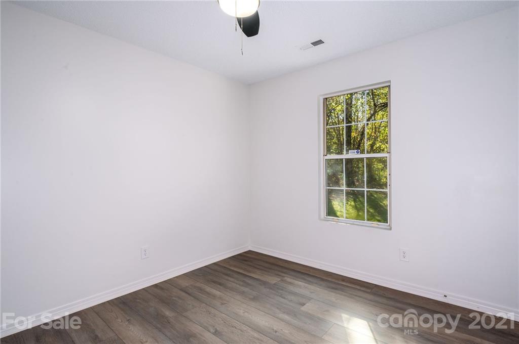 1401 Locust Grove Road Hendersonville, NC 28792 - Photo 14 of 20 an empty room with a window