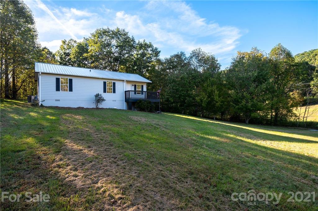1401 Locust Grove Road Hendersonville, NC 28792 - Photo 5 of 20 a view of a house with a yard