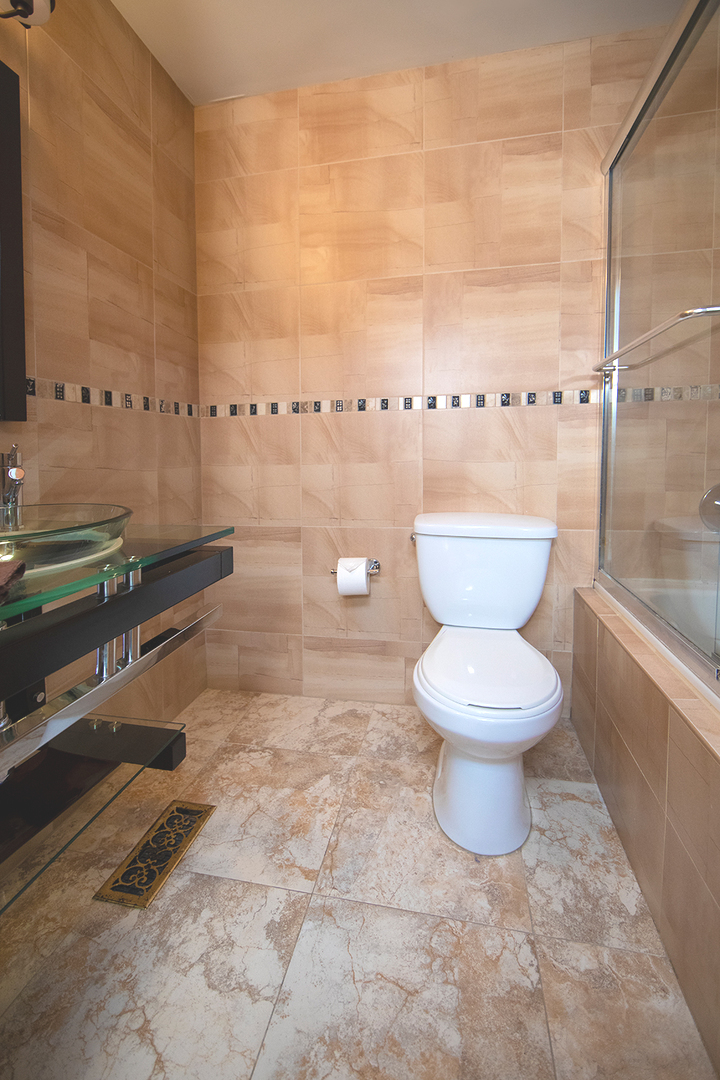 8316 High Point Circle, Unit F Darien, IL 60561 - Photo 15 of 24 a bathroom with a toilet sink and shower