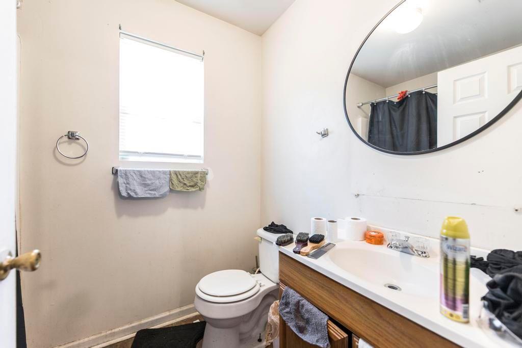 210 Perry Railroad Street Fort Valley, GA 31030 - Photo 11 of 45 a bathroom with a sink mirror and toilet