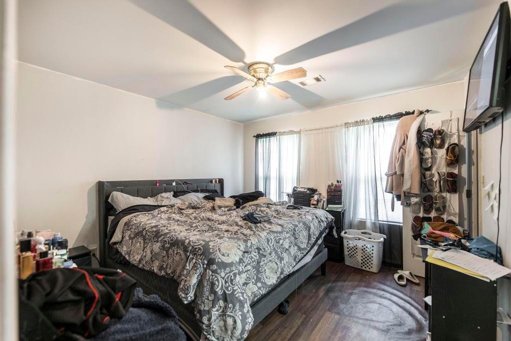 210 Perry Railroad Street Fort Valley, GA 31030 - Photo 14 of 45 a bedroom with bed and a chandelier