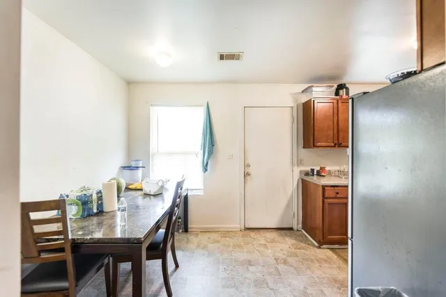 a bathroom with a double vanity sink and mirror