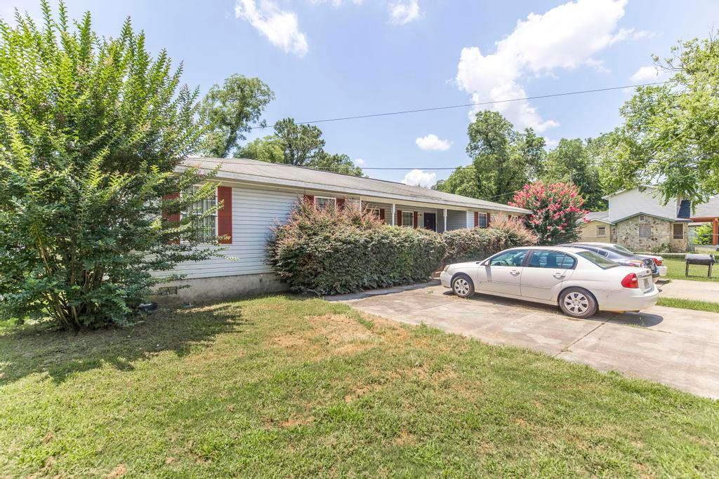 210 Perry Railroad Street Fort Valley, GA 31030 - Photo 2 of 45 a view of a house with a garden and pathway