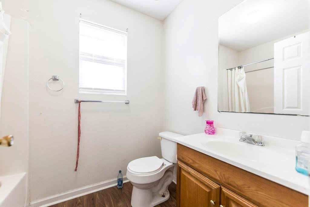 210 Perry Railroad Street Fort Valley, GA 31030 - Photo 22 of 45 a bathroom with a sink toilet and mirror