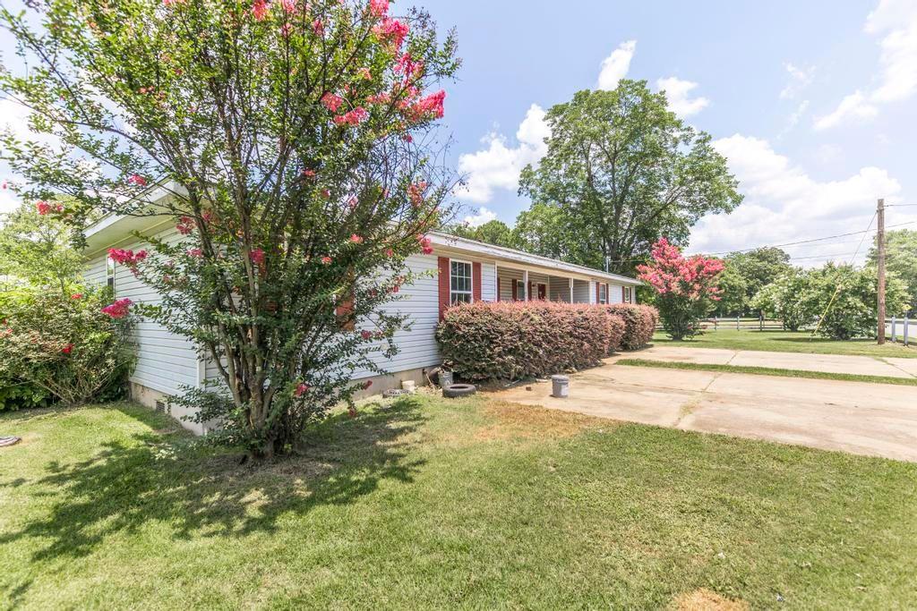210 Perry Railroad Street Fort Valley, GA 31030 - Photo 26 of 45 a house view with swimming pool and garden