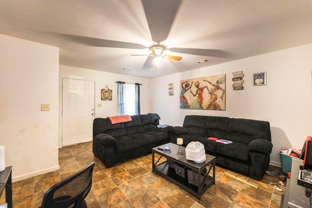 210 Perry Railroad Street Fort Valley, GA 31030 - Photo 27 of 45 a living room with furniture and a ceiling fan