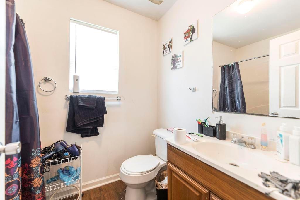210 Perry Railroad Street Fort Valley, GA 31030 - Photo 32 of 45 a bathroom with a sink toilet and mirror