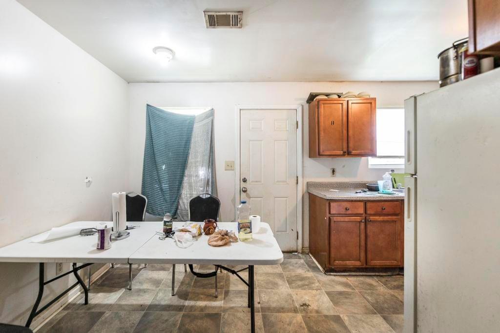 210 Perry Railroad Street Fort Valley, GA 31030 - Photo 35 of 45 a view of a kitchen area with furniture and stove