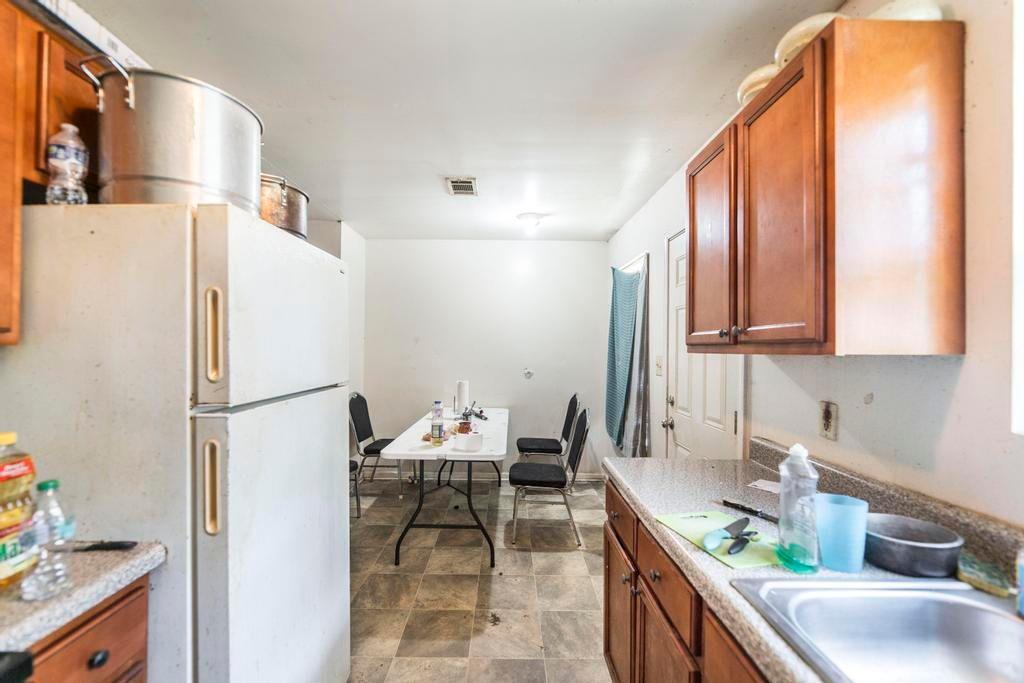 210 Perry Railroad Street Fort Valley, GA 31030 - Photo 37 of 45 a kitchen with stainless steel appliances a refrigerator and a sink