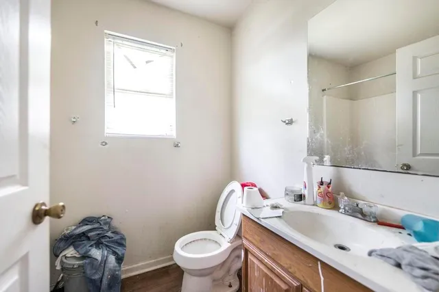a bathroom with a sink toilet and vanity