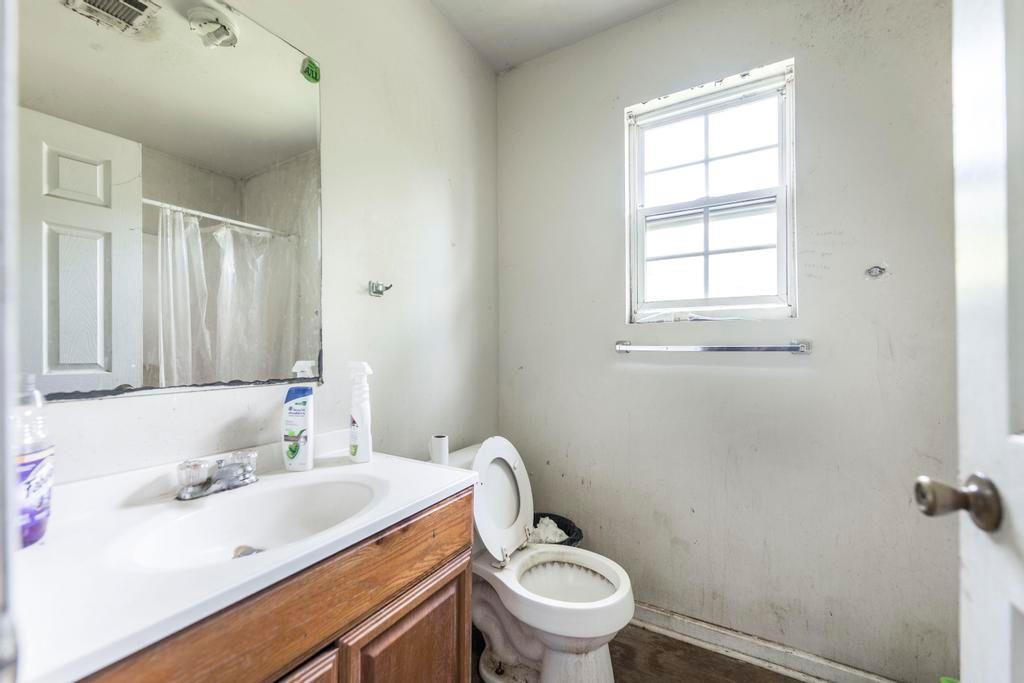 210 Perry Railroad Street Fort Valley, GA 31030 - Photo 39 of 45 a bathroom with a sink toilet and vanity