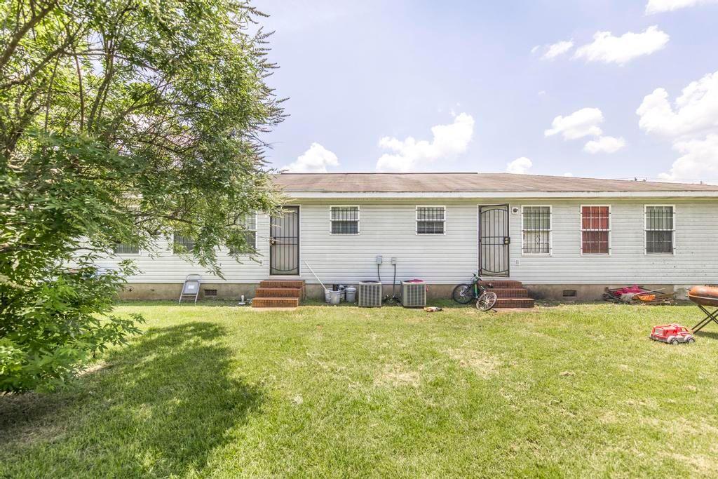 210 Perry Railroad Street Fort Valley, GA 31030 - Photo 43 of 45 a view of a house with a patio and a yard