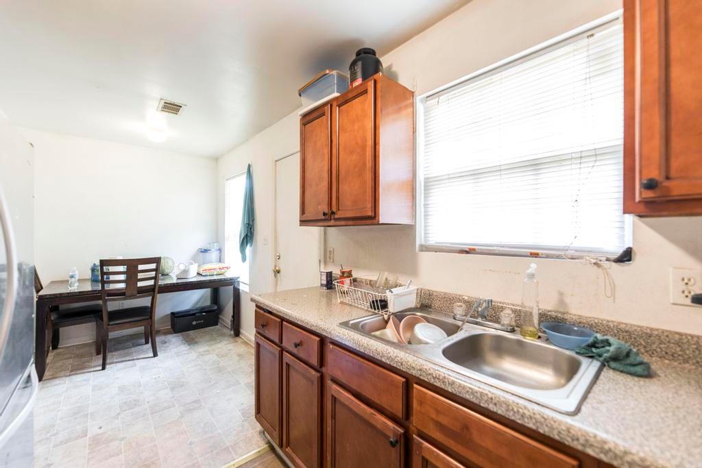 210 Perry Railroad Street Fort Valley, GA 31030 - Photo 6 of 45 a kitchen with granite countertop a sink and a window