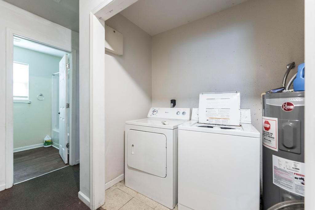 210 Perry Railroad Street Fort Valley, GA 31030 - Photo 9 of 45 a utility room with dryer and washer
