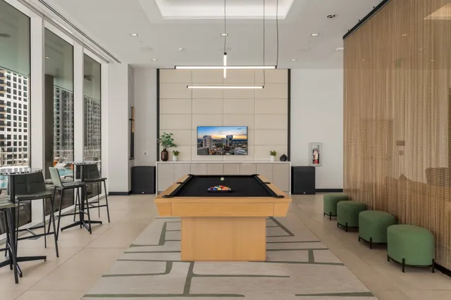 a living room with furniture a table and a fireplace