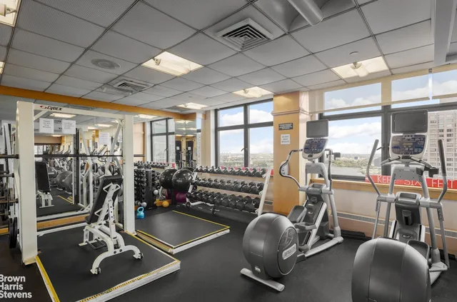 a view of a kitchen with granite countertop a large window and a sink