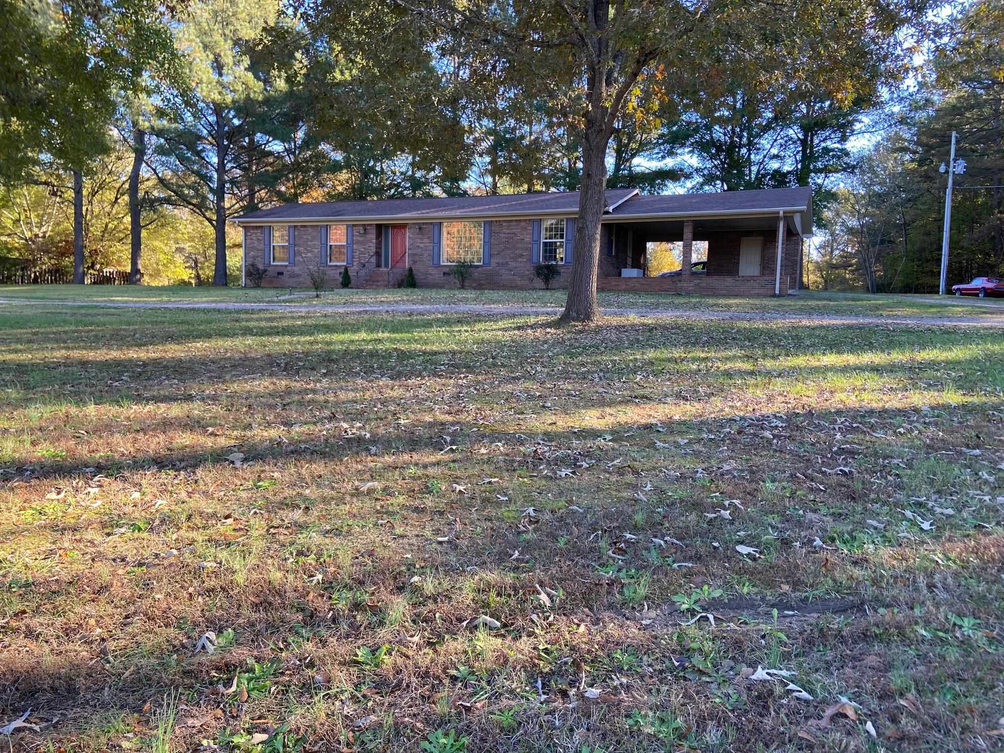 610 Old Finger Road Henderson, TN 38340 - Photo 1 of 24 a front view of a house with a yard