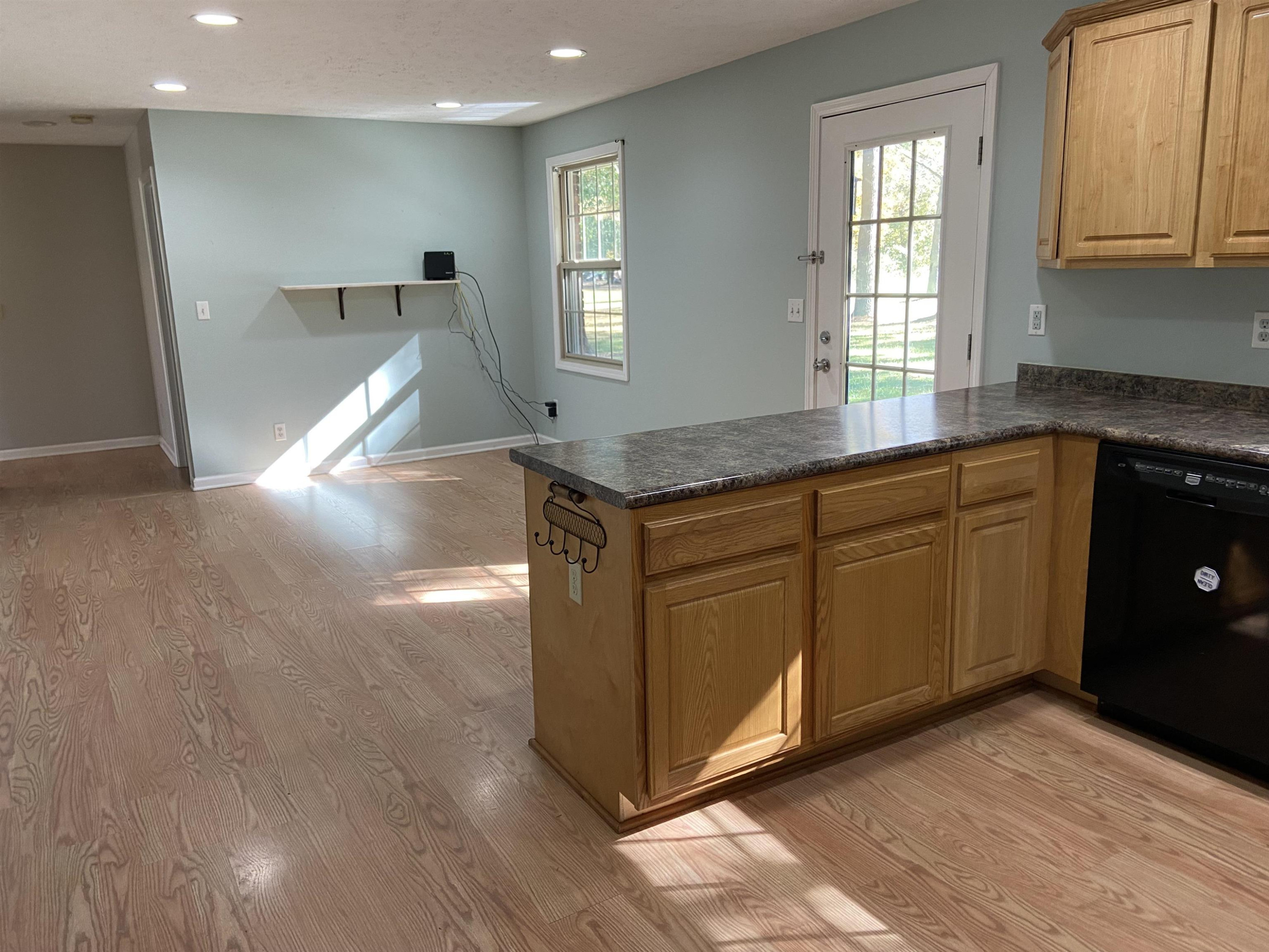 610 Old Finger Road Henderson, TN 38340 - Photo 14 of 24 a kitchen with stainless steel appliances granite countertop a stove a sink and a refrigerator