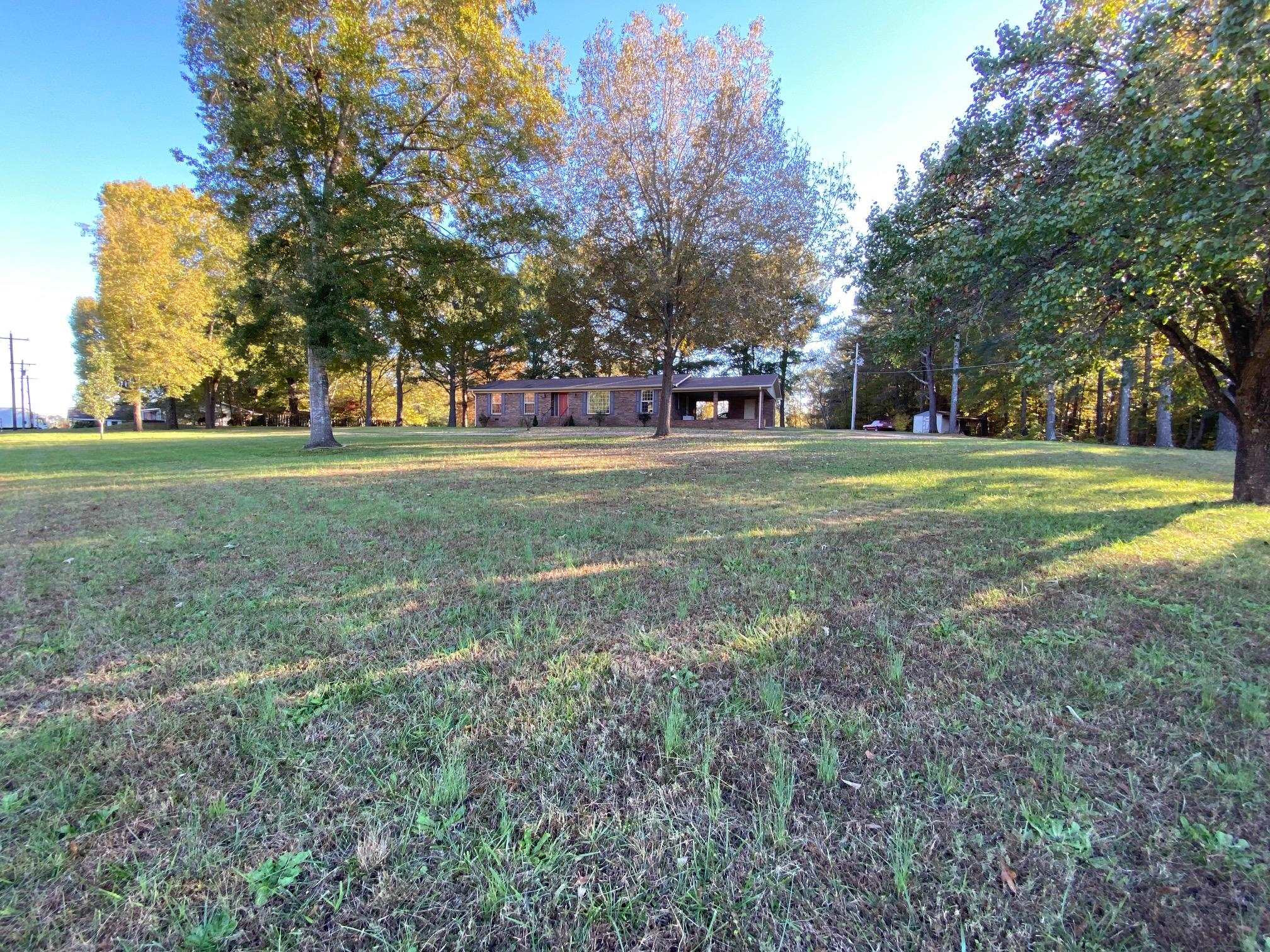 610 Old Finger Road Henderson, TN 38340 - Photo 21 of 24 a front view of a house with a yard and trees