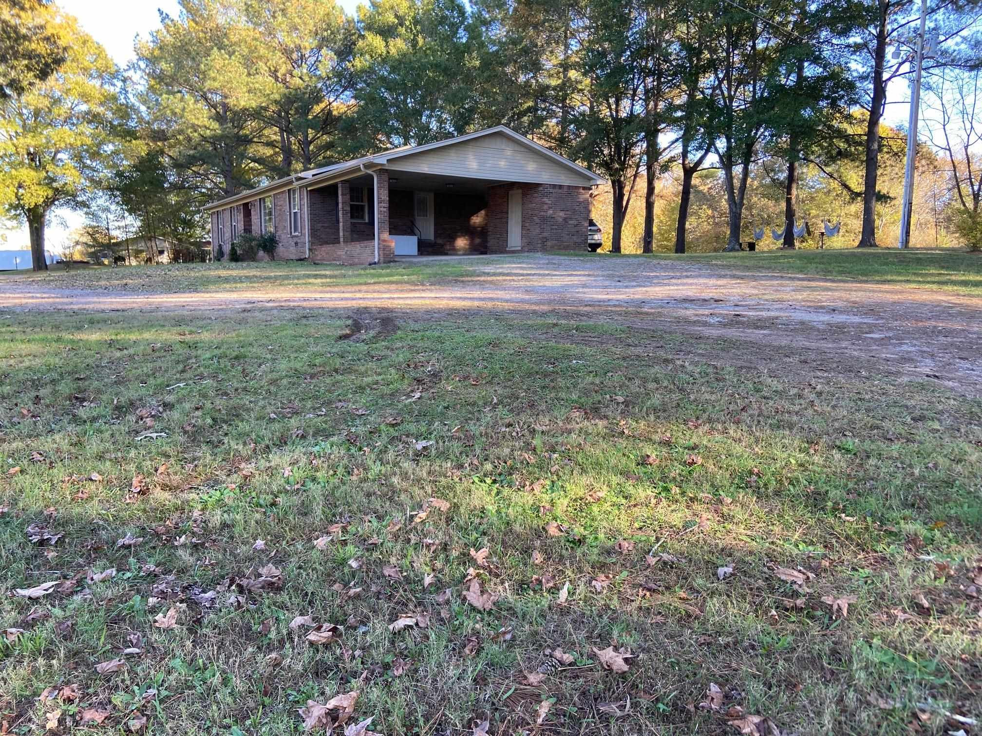 610 Old Finger Road Henderson, TN 38340 - Photo 22 of 24 a front view of a house with a yard