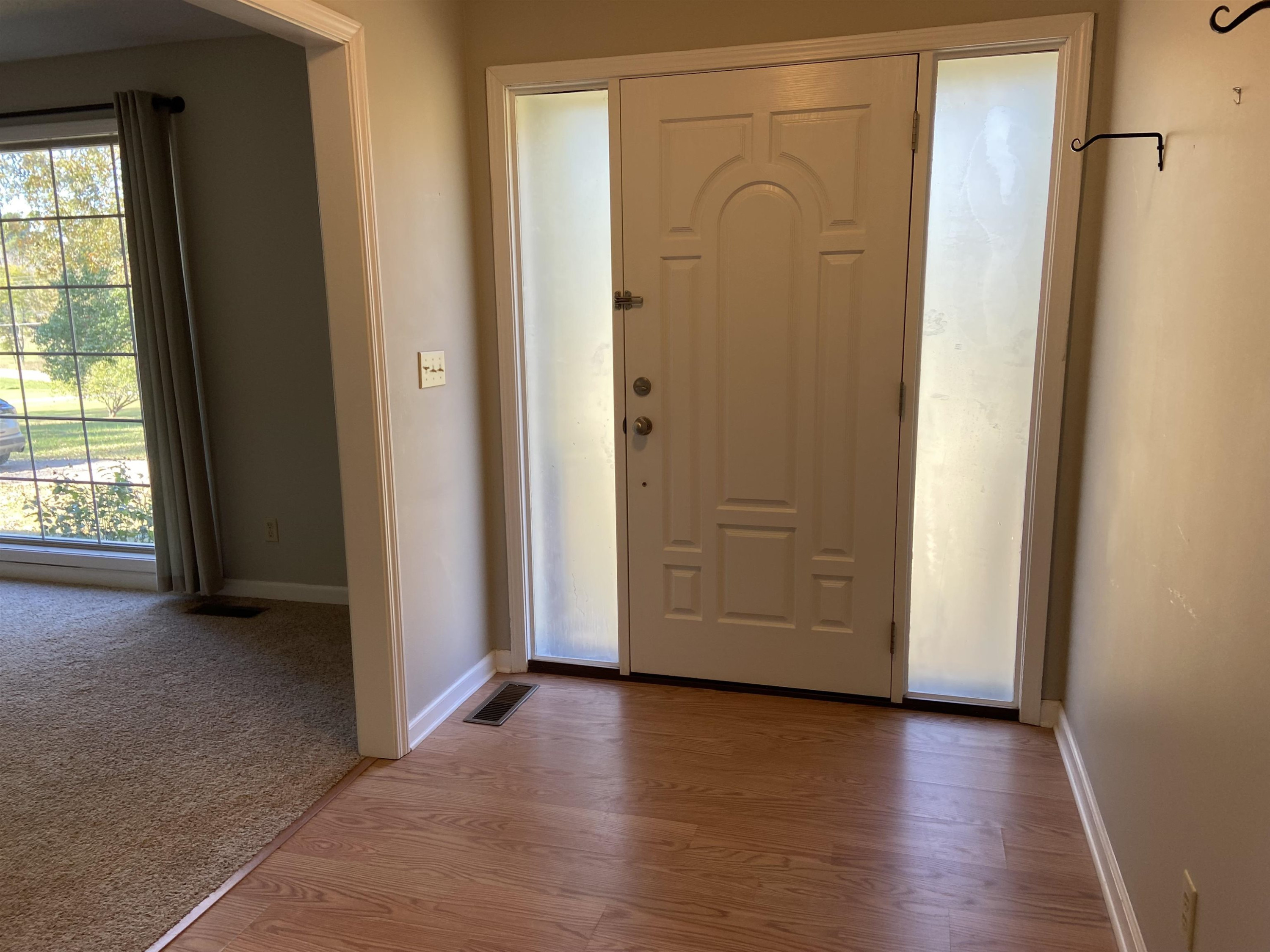 610 Old Finger Road Henderson, TN 38340 - Photo 4 of 24 an empty room with wooden floor and windows