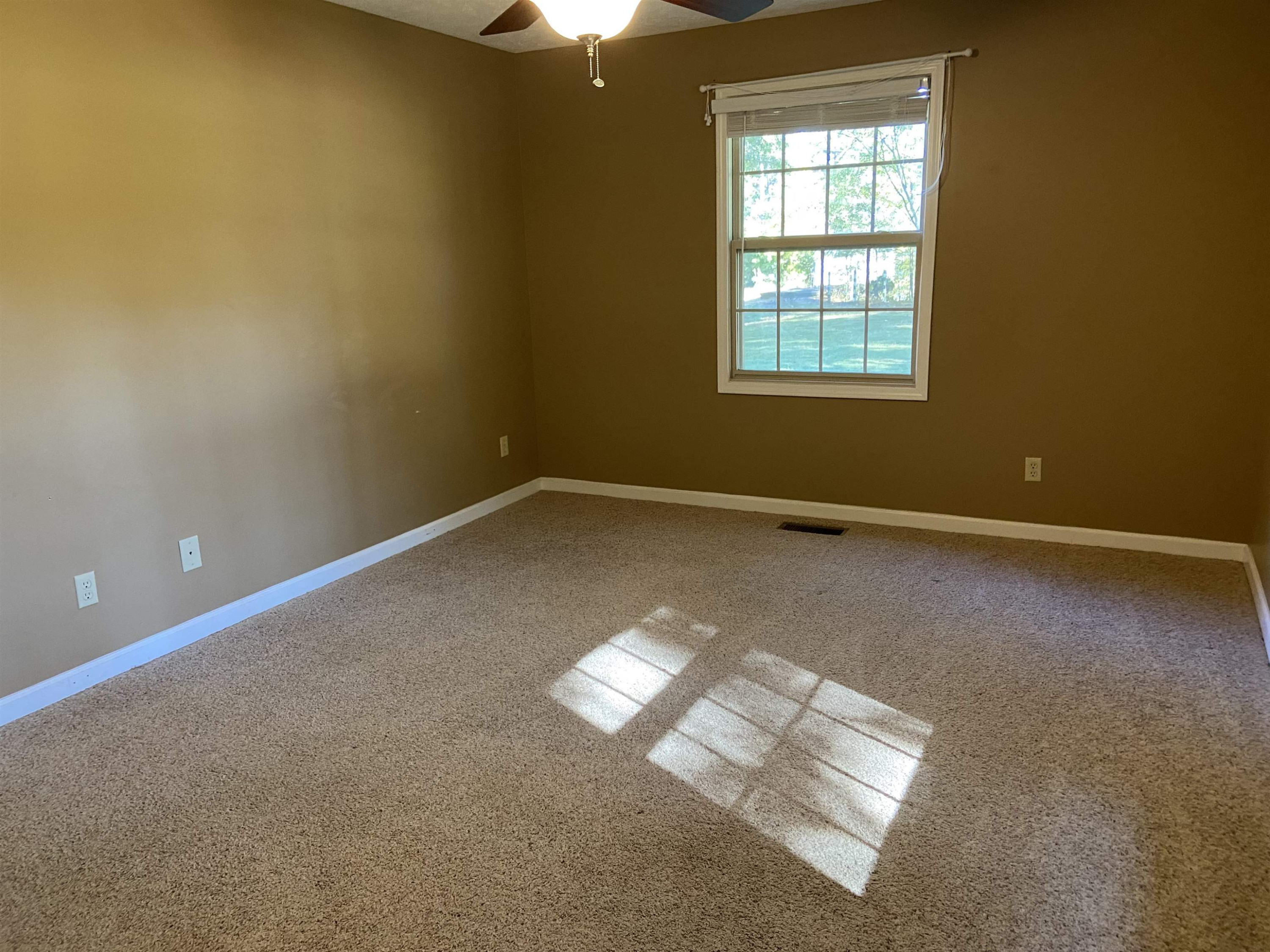 610 Old Finger Road Henderson, TN 38340 - Photo 7 of 24 an empty room with windows
