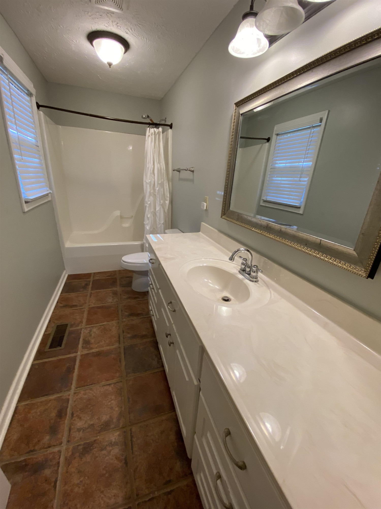610 Old Finger Road Henderson, TN 38340 - Photo 9 of 24 a bathroom with a sink a toilet a mirror and shower