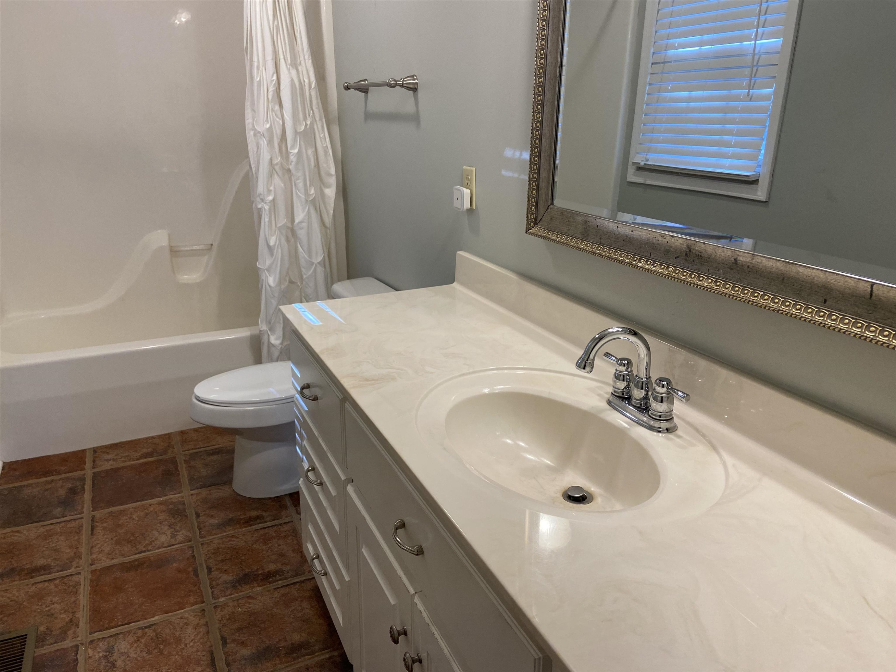 610 Old Finger Road Henderson, TN 38340 - Photo 10 of 24 a bathroom with a sink toilet and shower