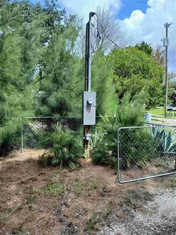 a backyard of a house with yard and outdoor seating
