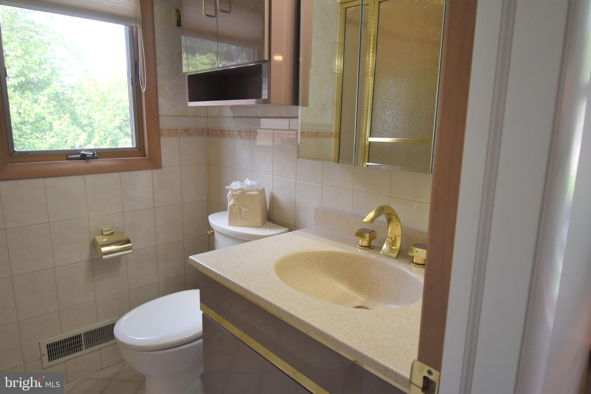 8 Forge Lane Cherry Hill, NJ 08002 - Photo 14 of 23 a bathroom with a sink toilet and mirror