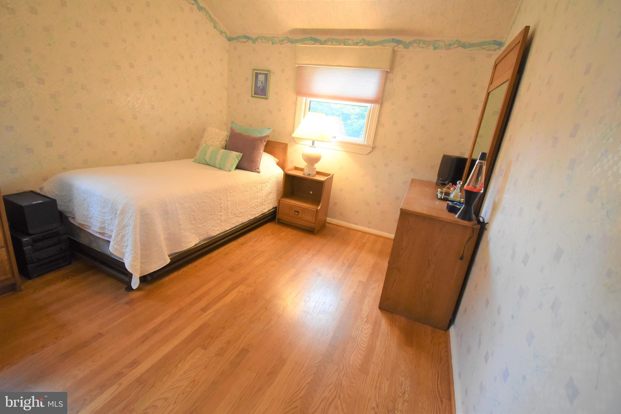 8 Forge Lane Cherry Hill, NJ 08002 - Photo 15 of 23 a bedroom with a bed and wooden floor