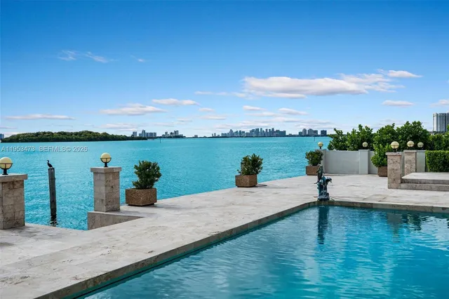 a wooden bench sitting next to a lake