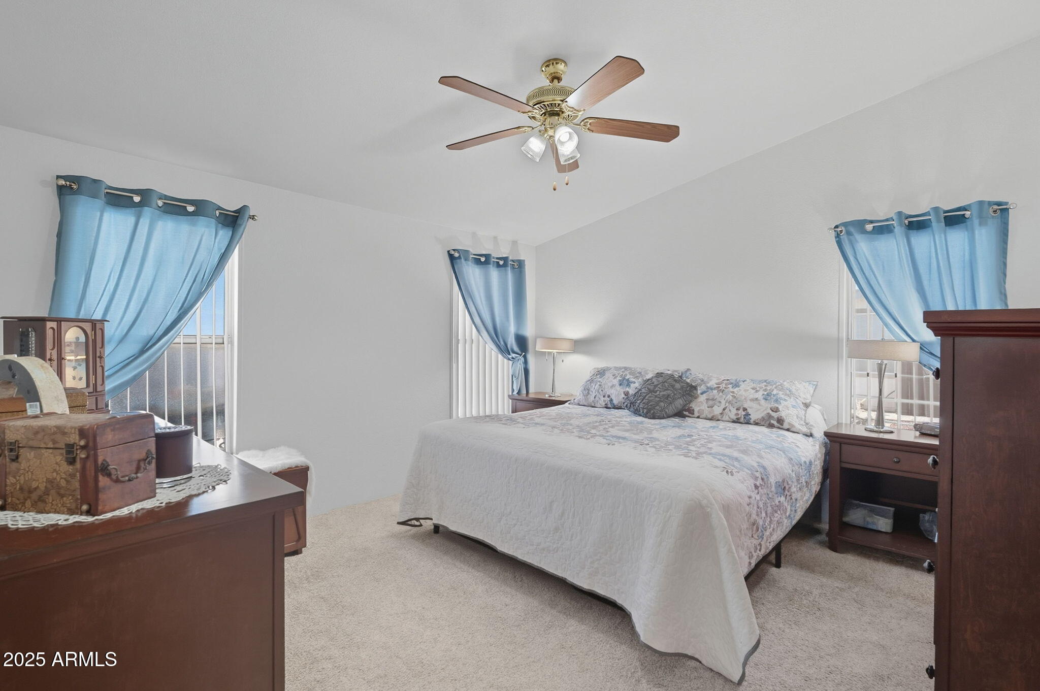 3700 South Tomahawk Road, Unit 39 Apache Junction, AZ 85119 - Photo 4 of 53 a bedroom with a bed and a chandelier