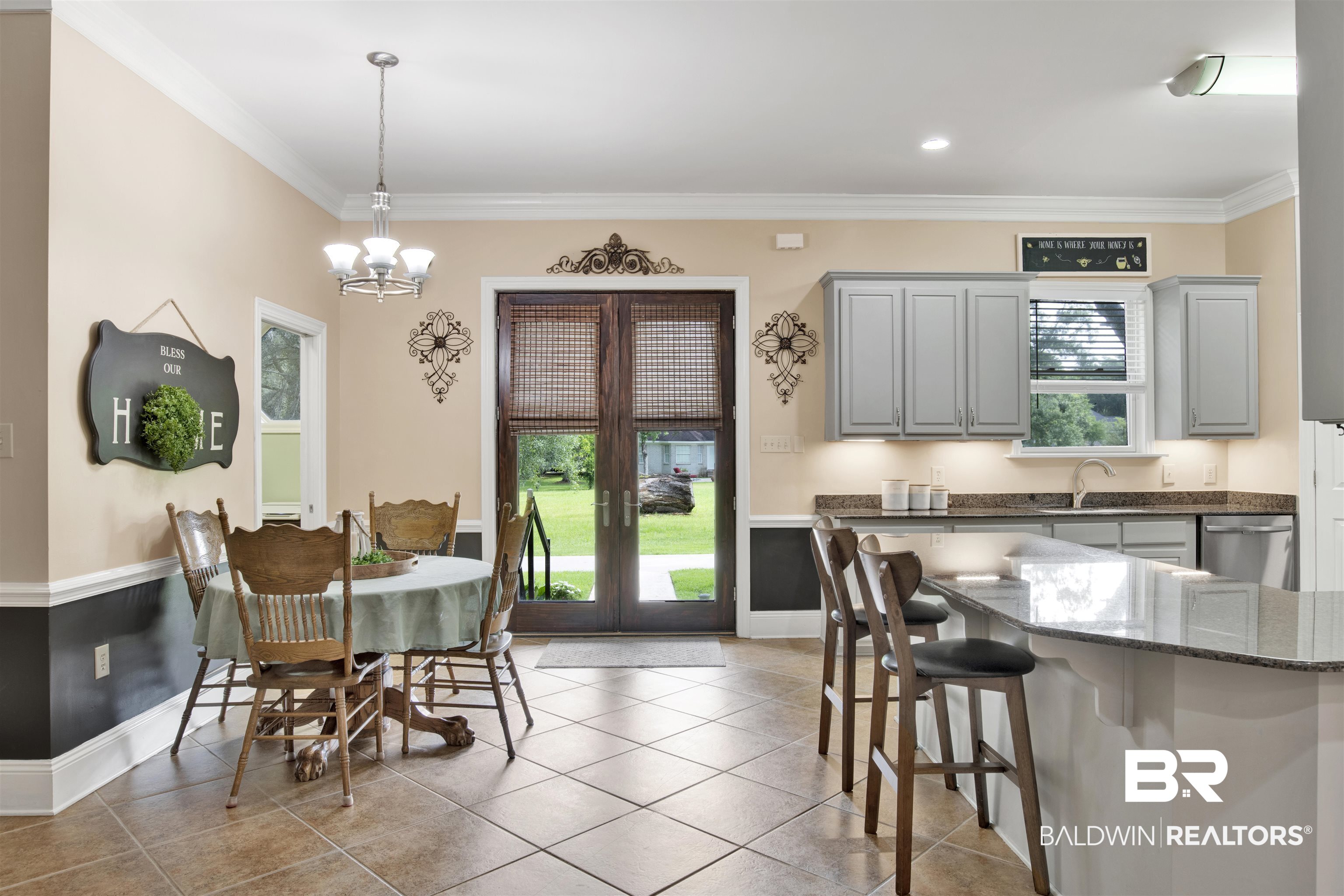 4340 Hamilton Oaks Lane Mobile, AL 36695 - Photo 14 of 51 Kitchen featuring crown molding, a wealth of natural light, and light tile flooring