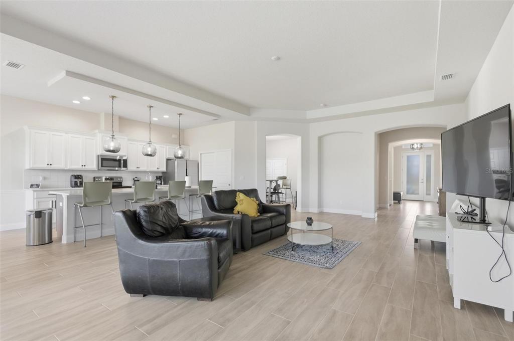 21 Spring Street Palm Coast, FL 32164 - Photo 11 of 57 a living room with furniture and a view of kitchen