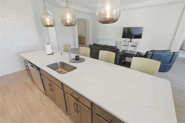 a kitchen with a sink and cabinets