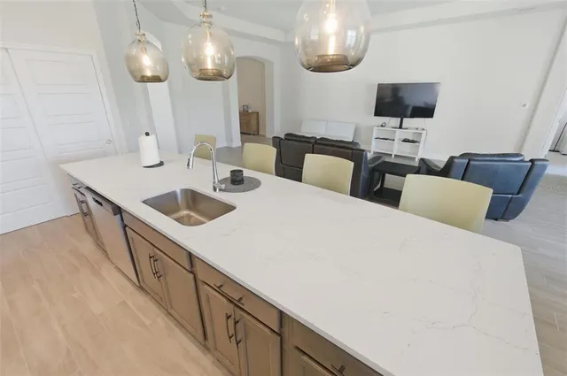 a kitchen with a sink and cabinets